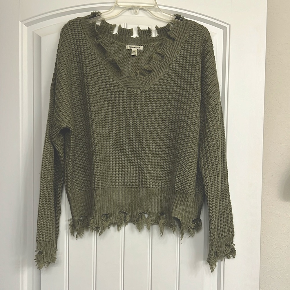 Olive green fringed sweater. Can be worn off the shoulder.